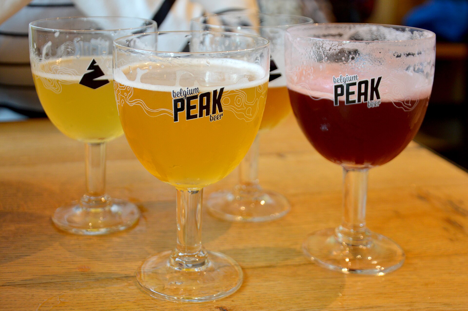 Three Belgian beers in their own glasses